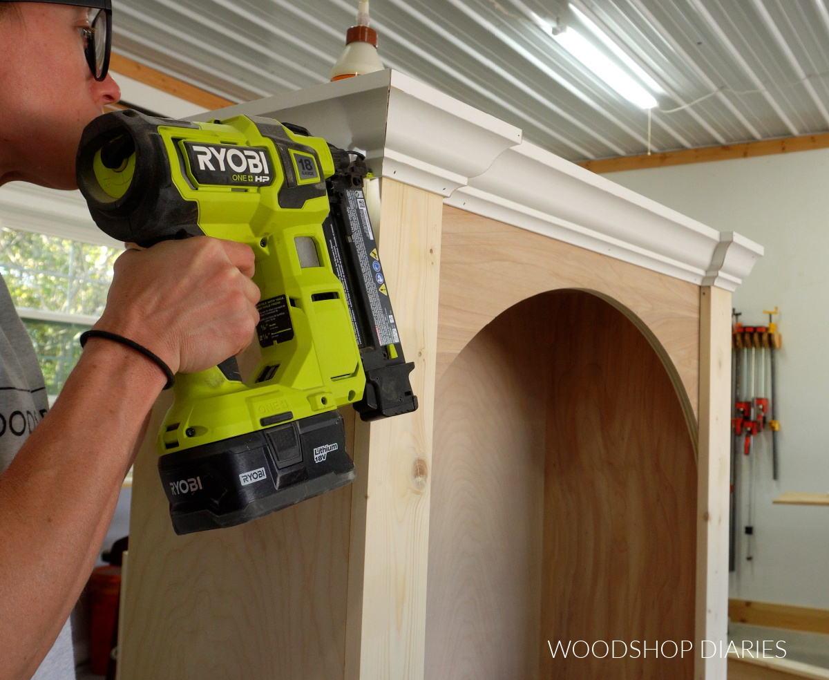 Shara Woodshop Diaries nailing crown molding around tops of bookcases