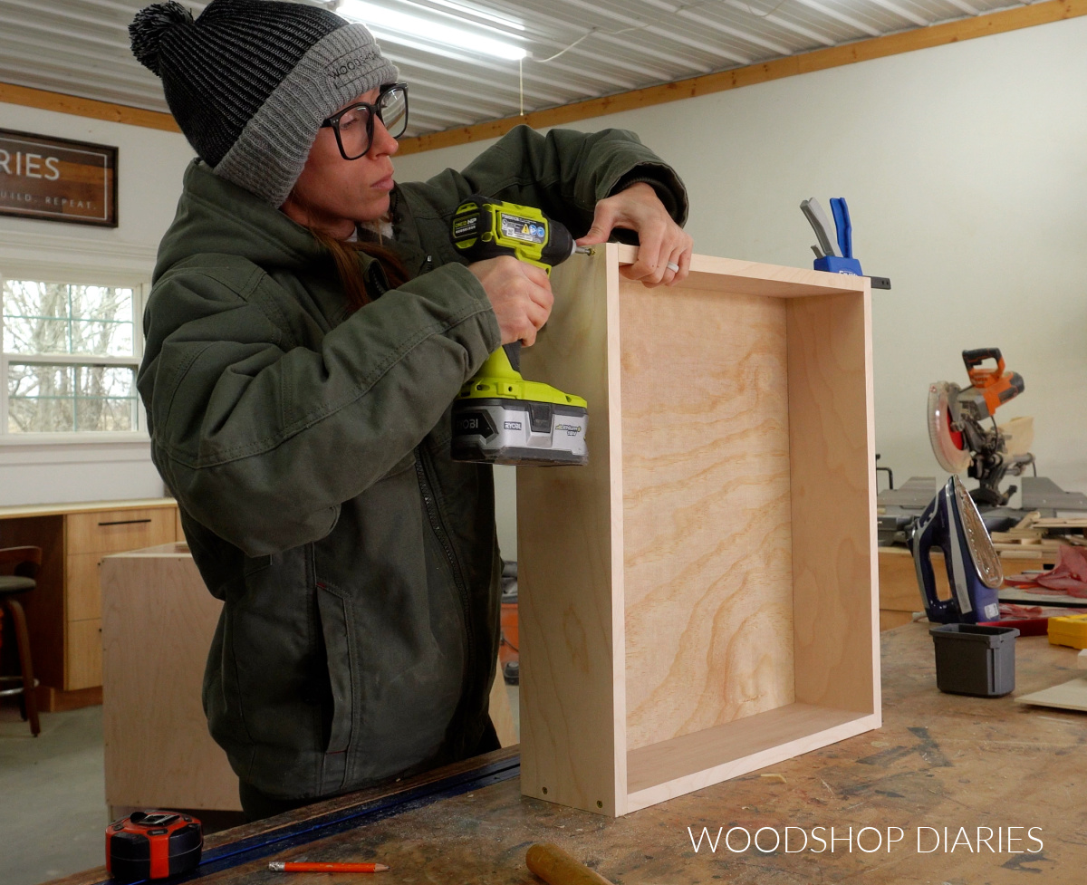 Shara Woodshop Diaries assembling large drawer box on workbench with wood screws