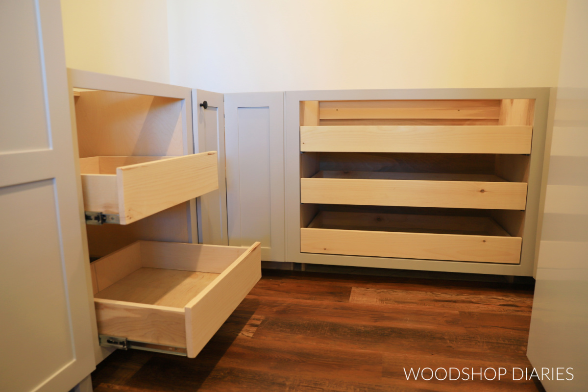 walk in pantry with two pull out shelf cabinets--one in the back with three drawers and one on the left with 2 drawers