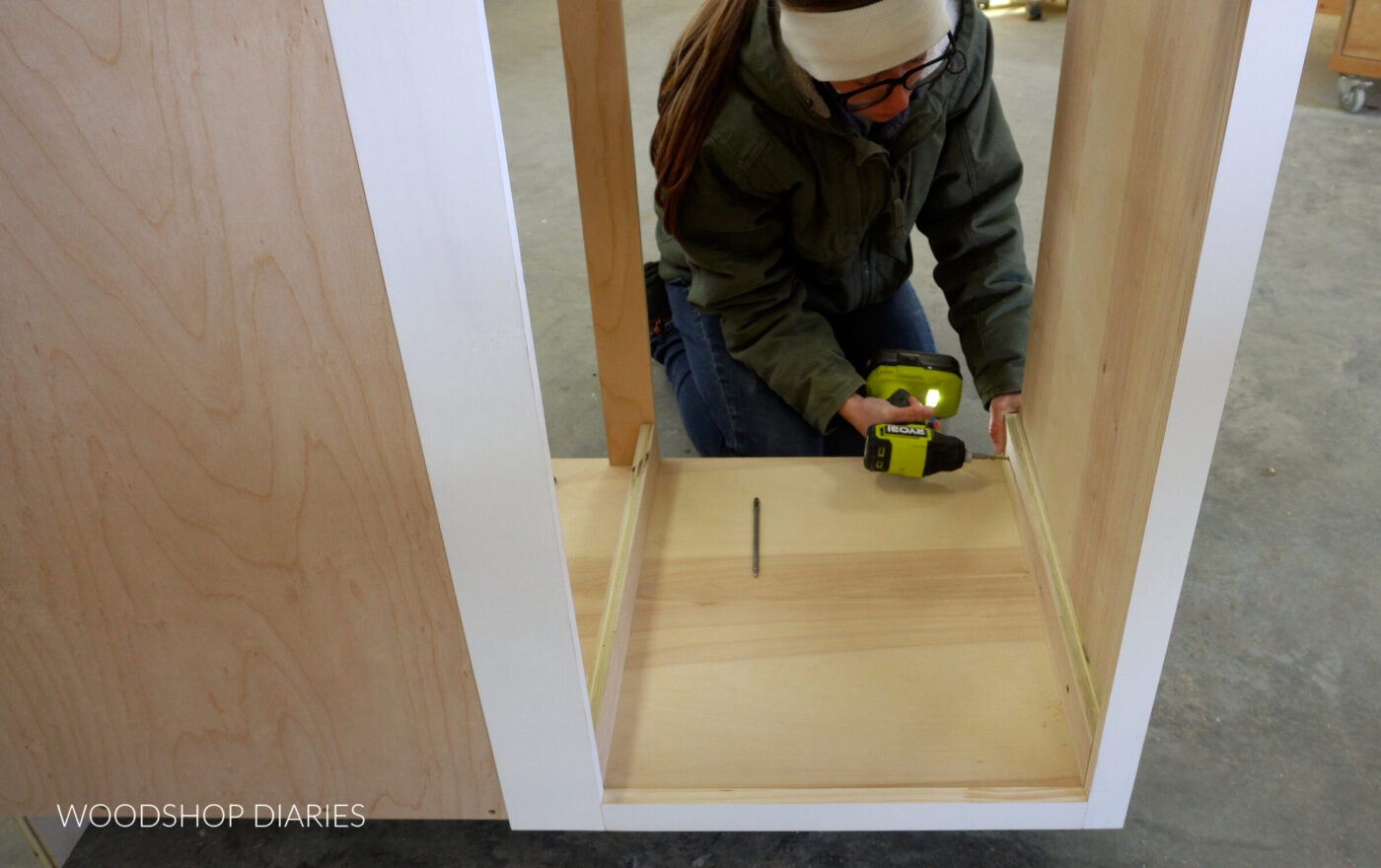Shara Woodshop Diaries installing drawer slide spacer blocks inside cabinet
