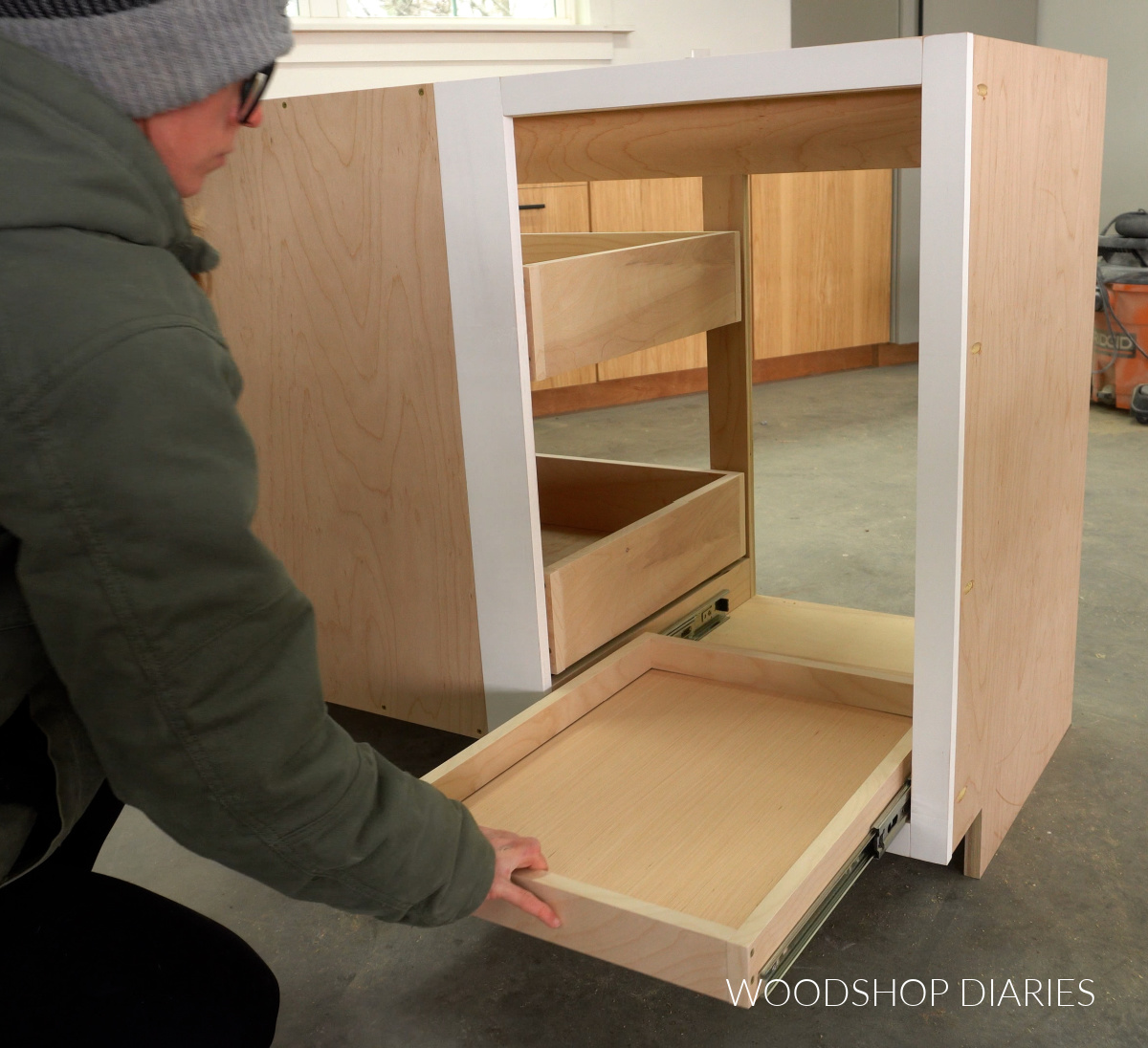 Sliding drawers into blind corner cabinet