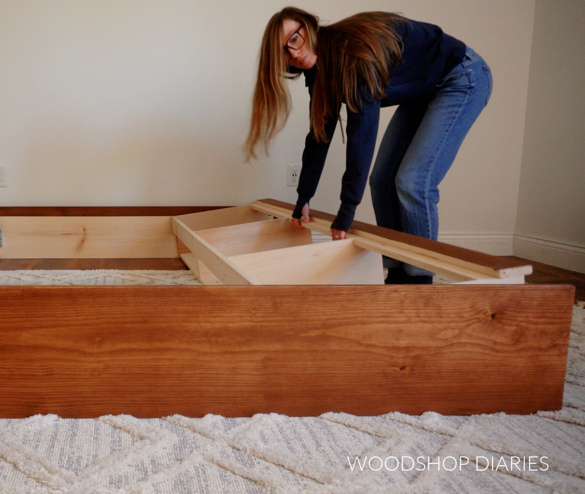 Shara Woodshop Diaries placing side rail frames between head and footboard of storage bed