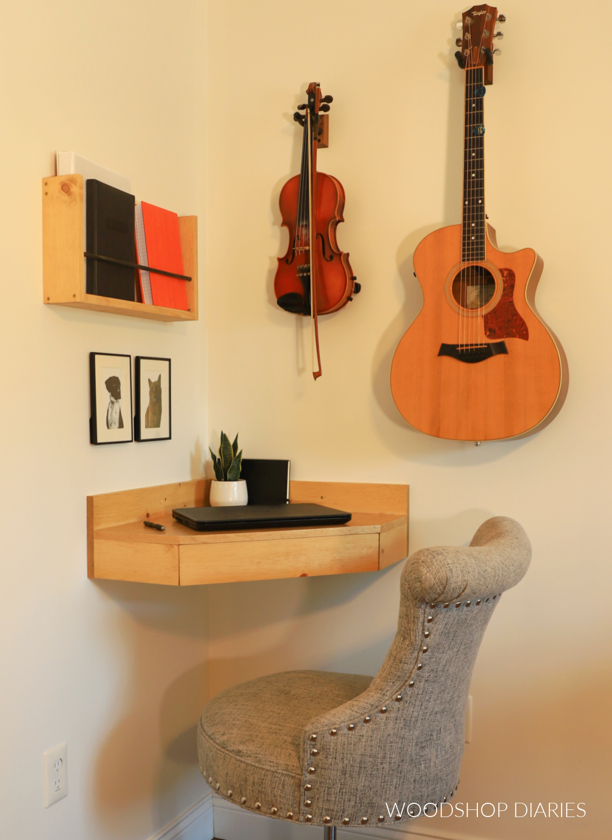 Corner floating desk with desk chair and instruments hung on the wall above it
