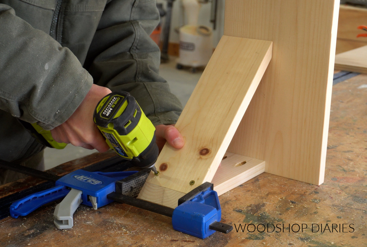 Shara Woodshop Diaries securing drawer slide braces in corner desk frame with screws