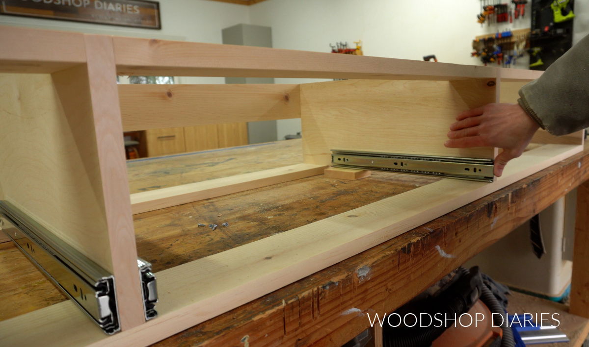 Side mount drawer slides installed into platform bed frame with drawers
