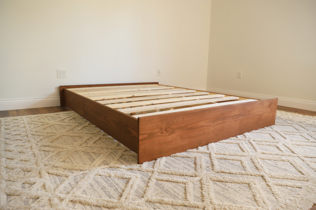 DIY platform bed frame completed and assembled with slats--no mattress on bed frame