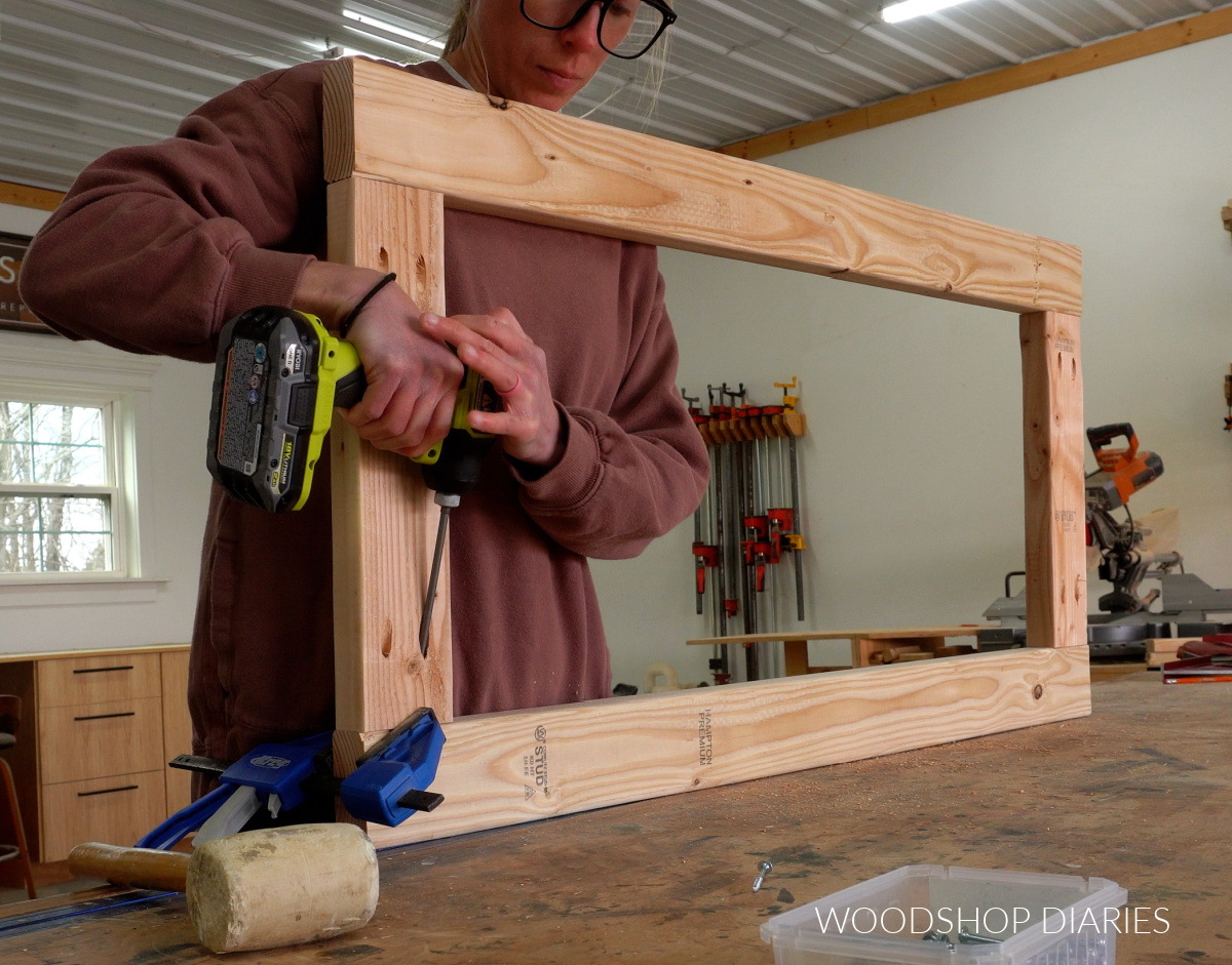 Shara Woodshop Diaries assembling bottom workbench frame with 2x4s and pocket hole screws