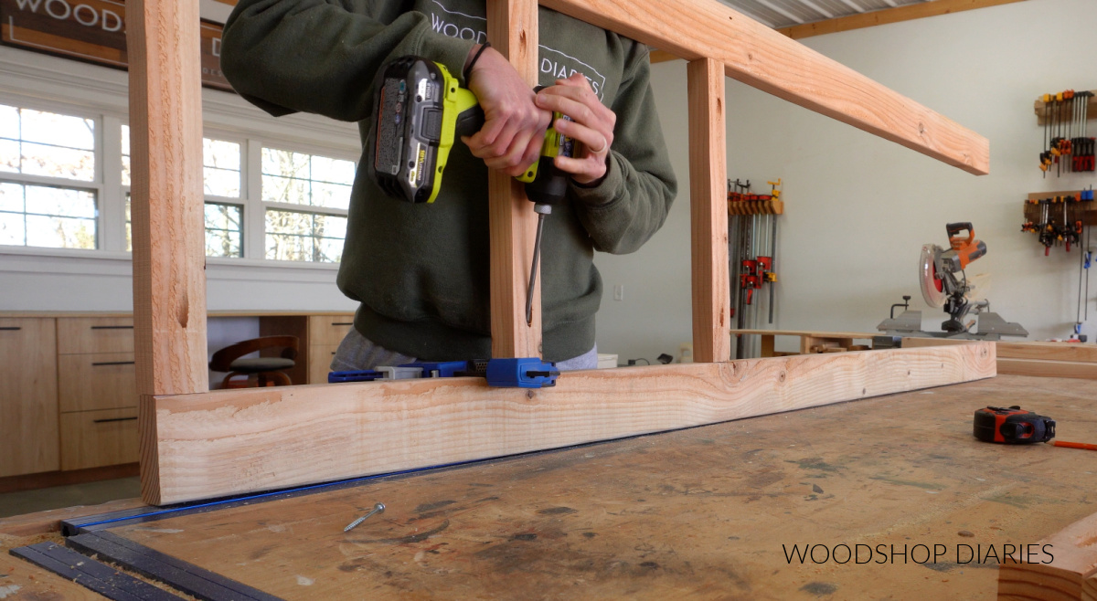 Shara Woodshop Diaries securing 2x2s between 2x4 corner posts of shelf frame with pocket holes and screws