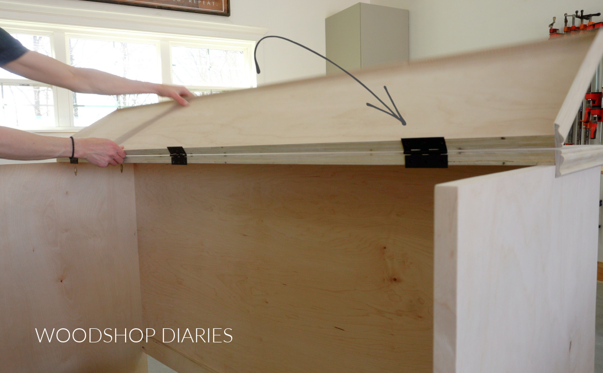 Top of murphy bed cabinet installed with butt hinges. Shara Woodshop Diaries opening front half of top panel