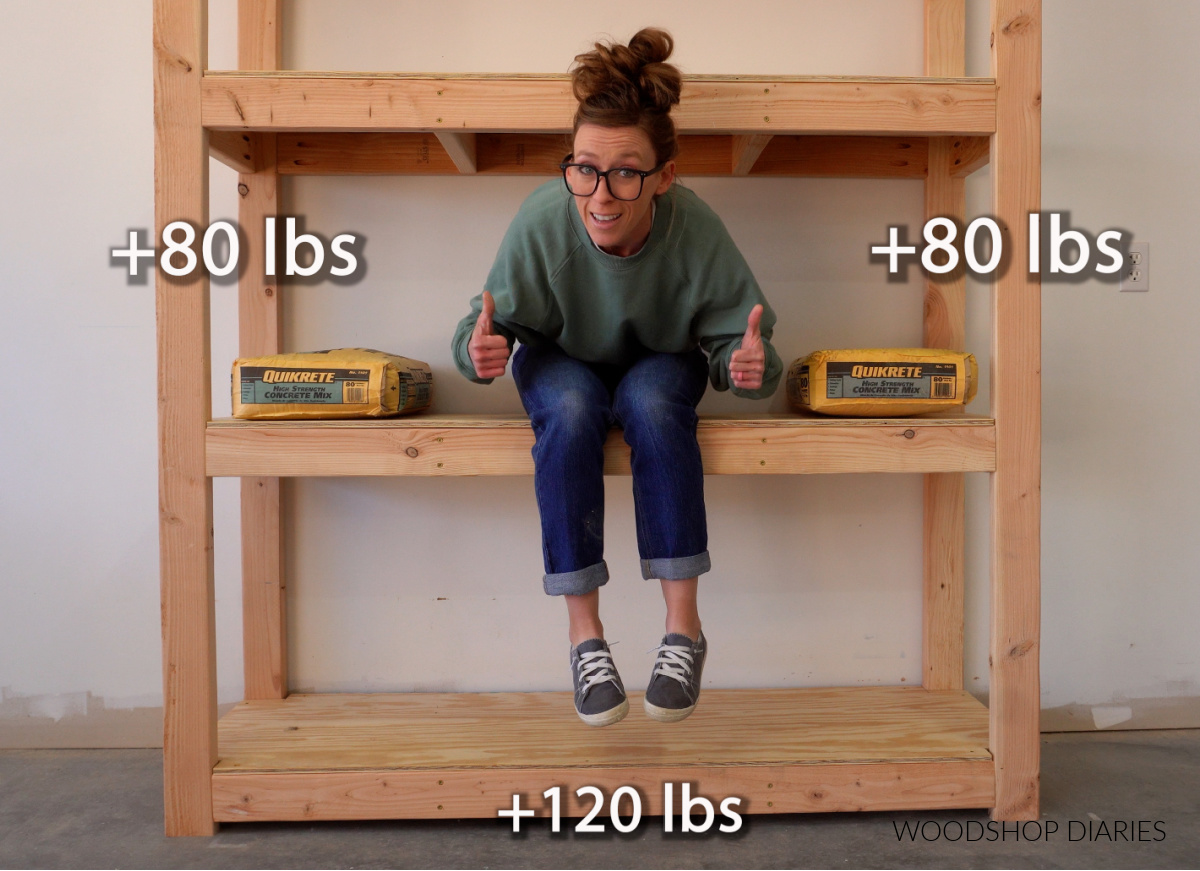 Shara Woodshop Diaries sitting on garage shelf with concrete bags to show how much weight they can hold