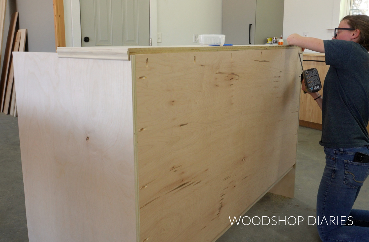 Shara Woodshop Diaries securing back part of top panel to cabinet with pocket hole screws