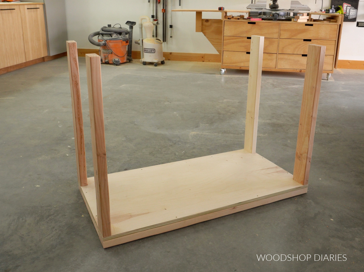 DIY mobile workbench bottom frame assembled with 4 legs attached on top