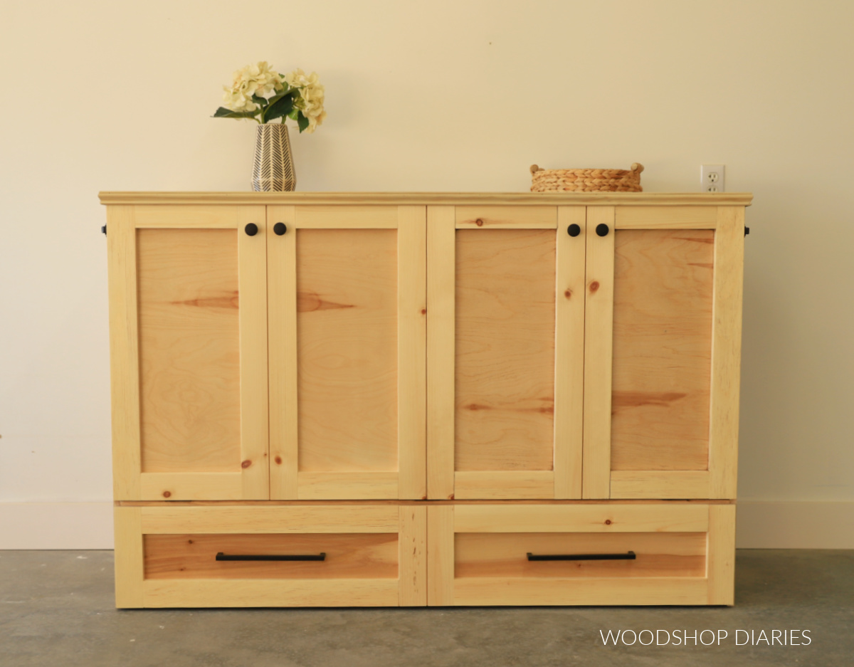 Console cabinet with four doors and two bottom drawers--front view of closed up murphy bed cabinet
