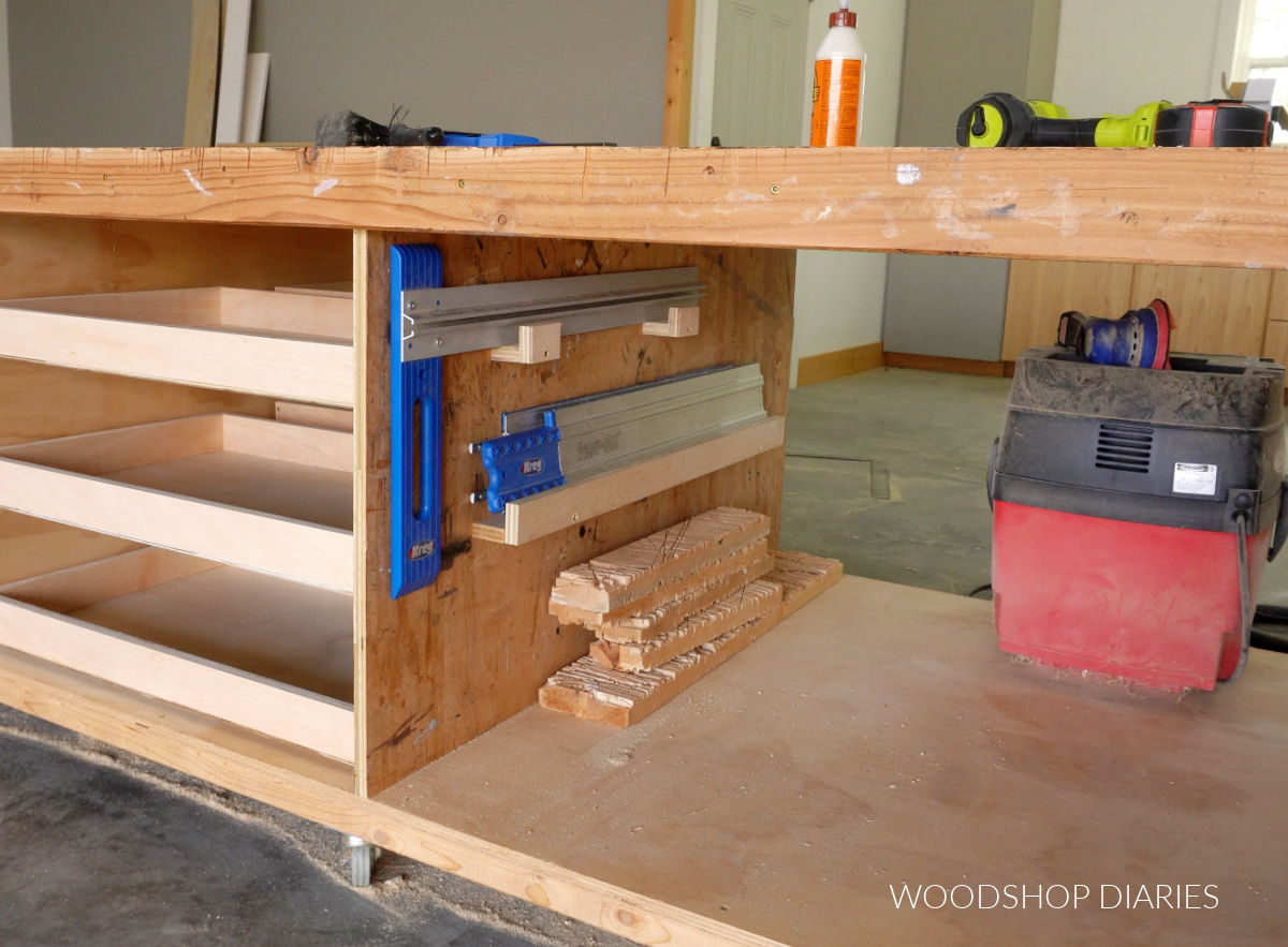 Workbench divider with brackets installed to hold Kreg Cutting guides