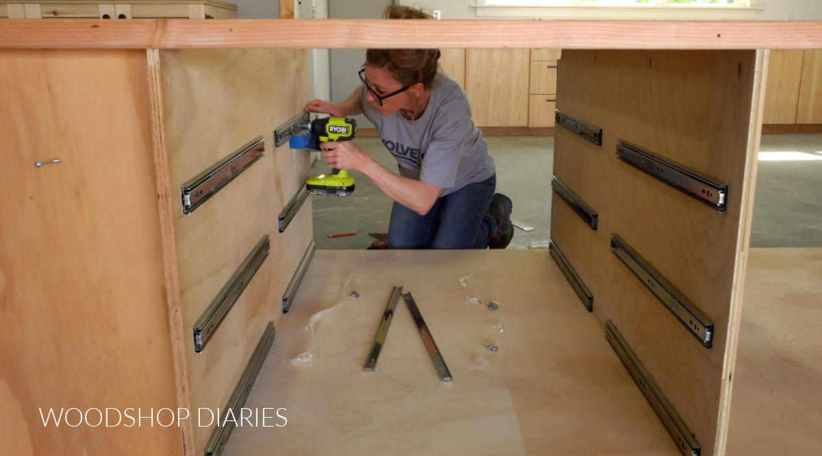 Shara Woodshop Diaries installing 6 pair of drawer slides between divider panels in large workbench
