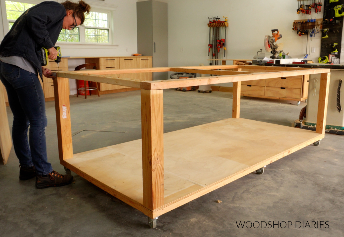 Shara Woodshop Diaries attaching top frame of mobile workbench to corner posts with screws