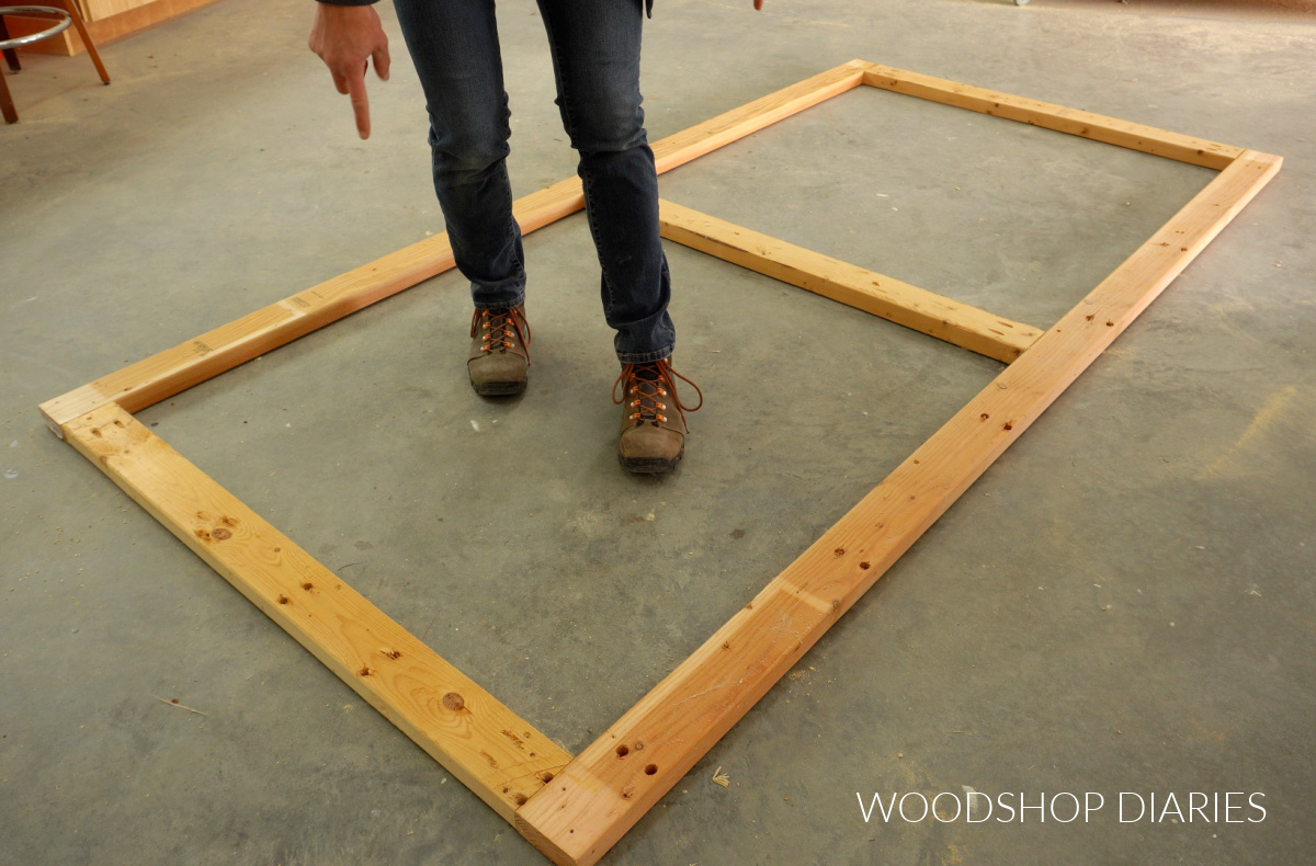 2x4 frame assembled with pocket hole screws laying on concrete floor of workshop