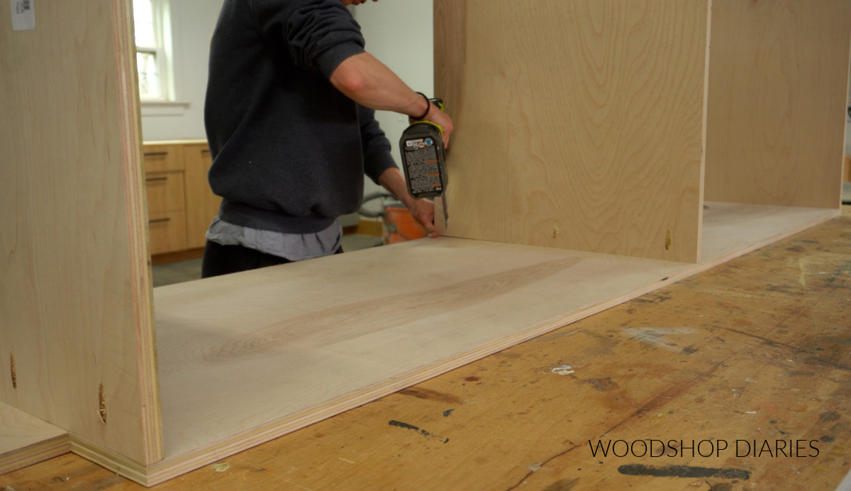 Shara Woodshop Diaries assembling tall garage storage cabinet on workbench with pocket holes and screws