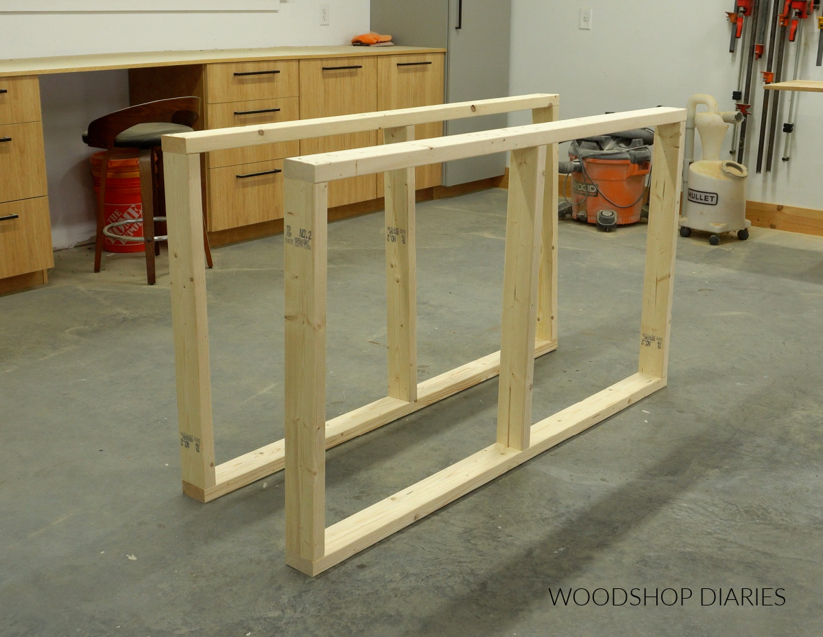 Two 2x4 frames with dividers on workshop floor