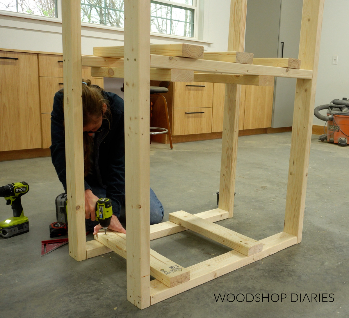 Shara Woodshop Diaries installing tote support shelves into workbench frame