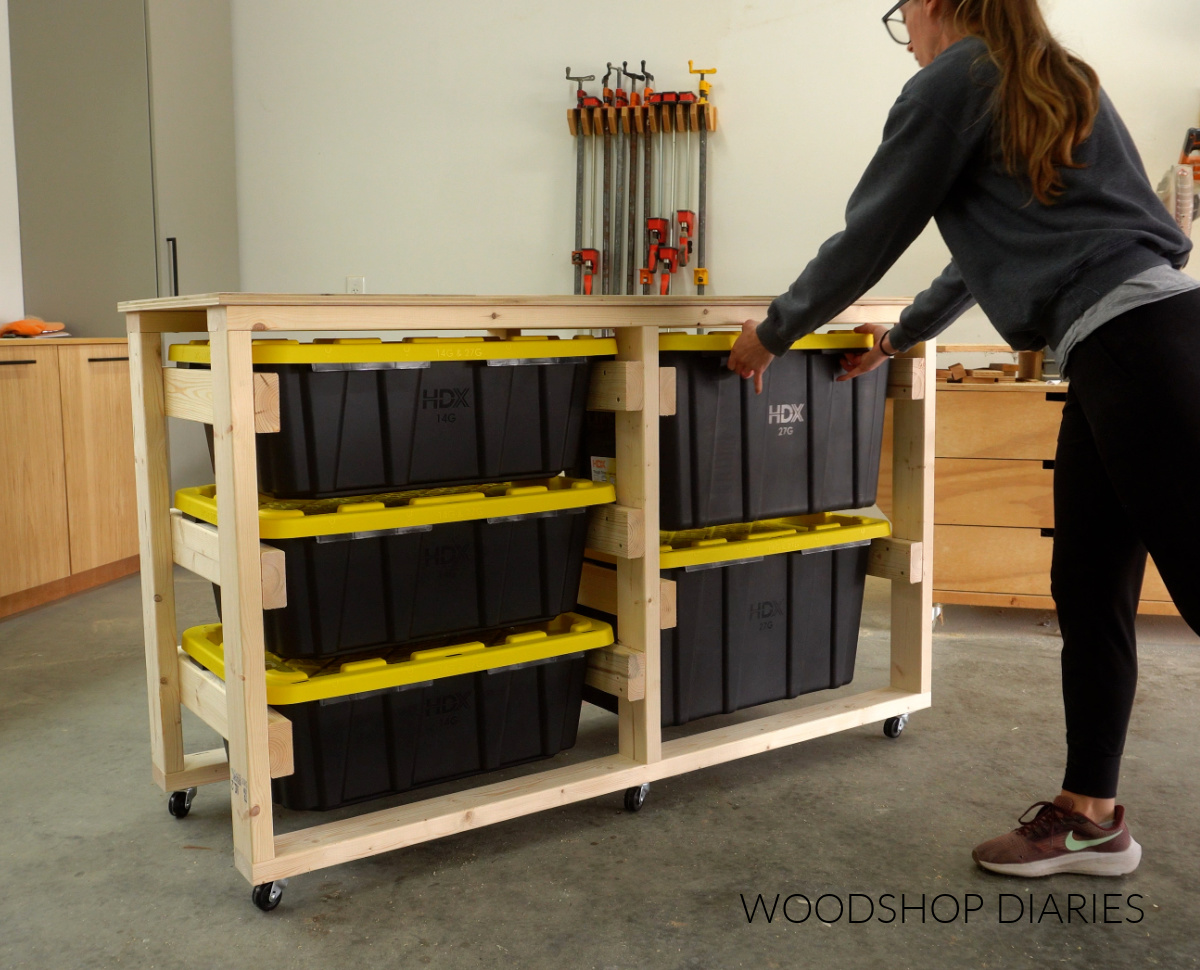 Shara Woodshop Diaries placing totes into workbench frame