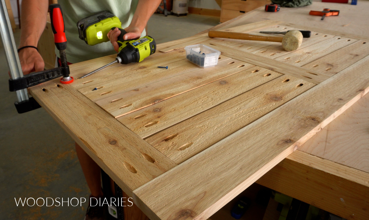 Shara Woodshop Diaries driving pocket holes to assemble storage box lid on workbench