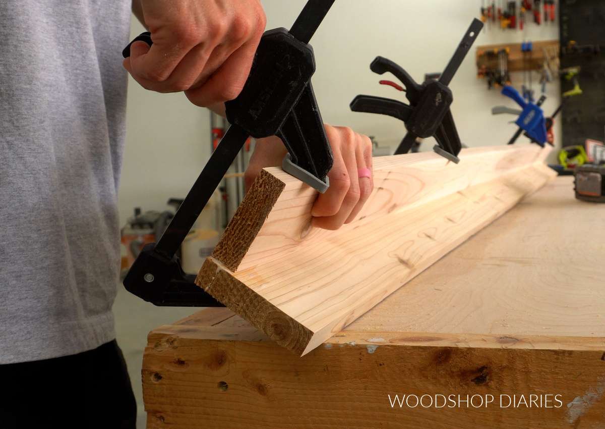 Shara Woodshop Diaries clamping cedar boards into "L shape" to make storage box legs