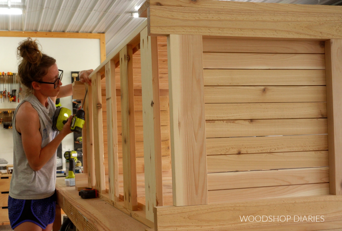 Shara Woodshop Diaries installing bottom slats of outdoor box with pocket holes and screws
