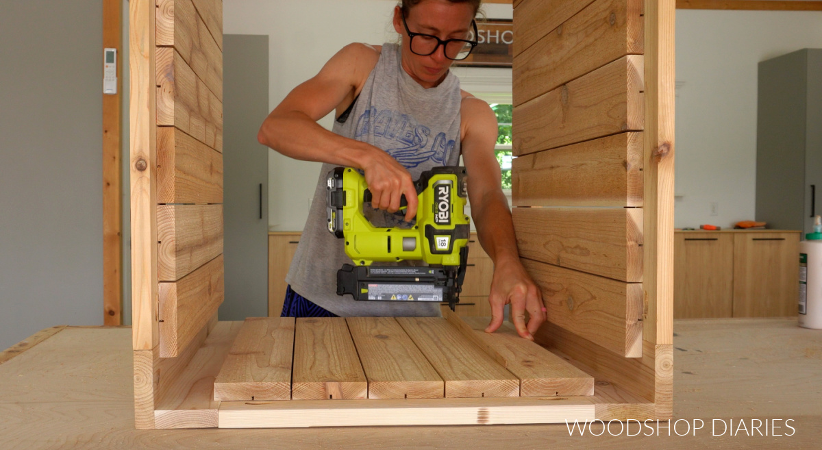 Shara Woodshop Diaries nailing slats on short sides of storage box