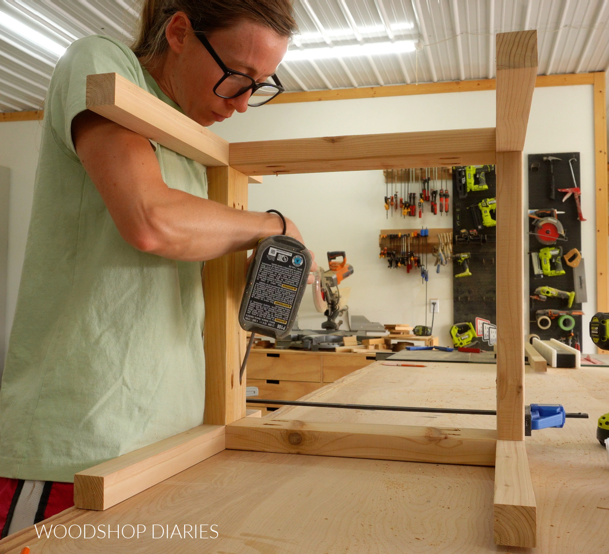 Shara Woodshop Diaries assembling umbrella stand table base on workbench with pocket holes and screws