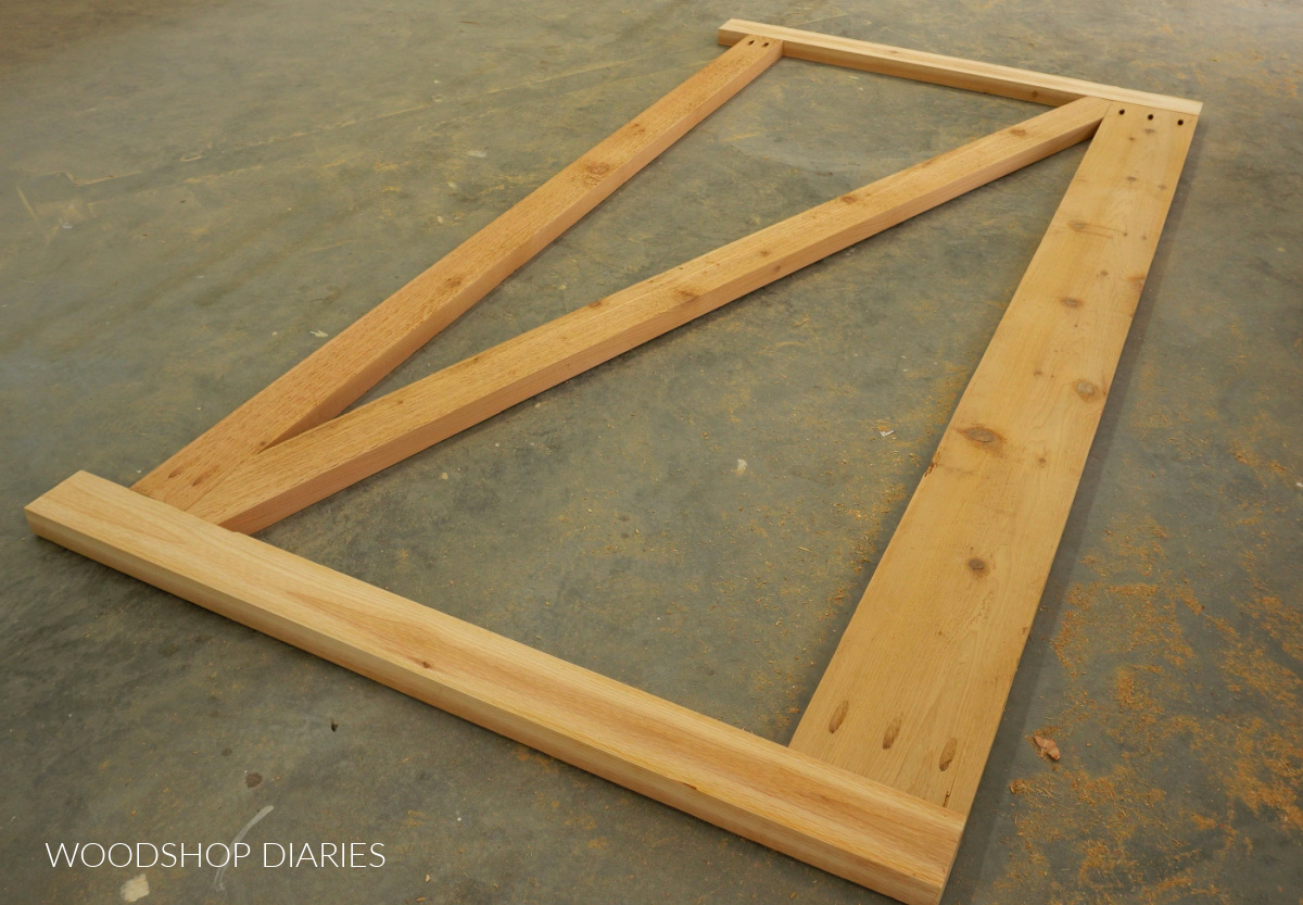 Diagonal brace cut to fit into wooden driveway gate frame