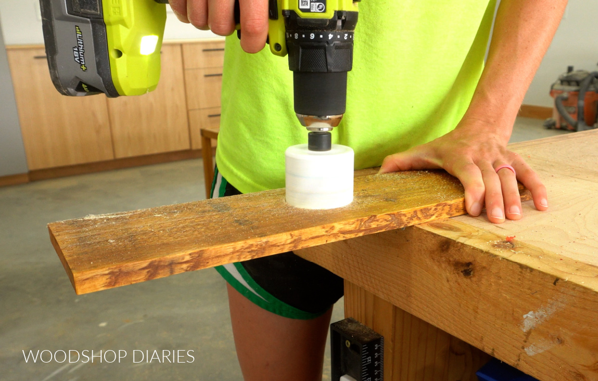 Shara Woodshop Diaries using hole saw to drill hole for umbrella base in wooden table