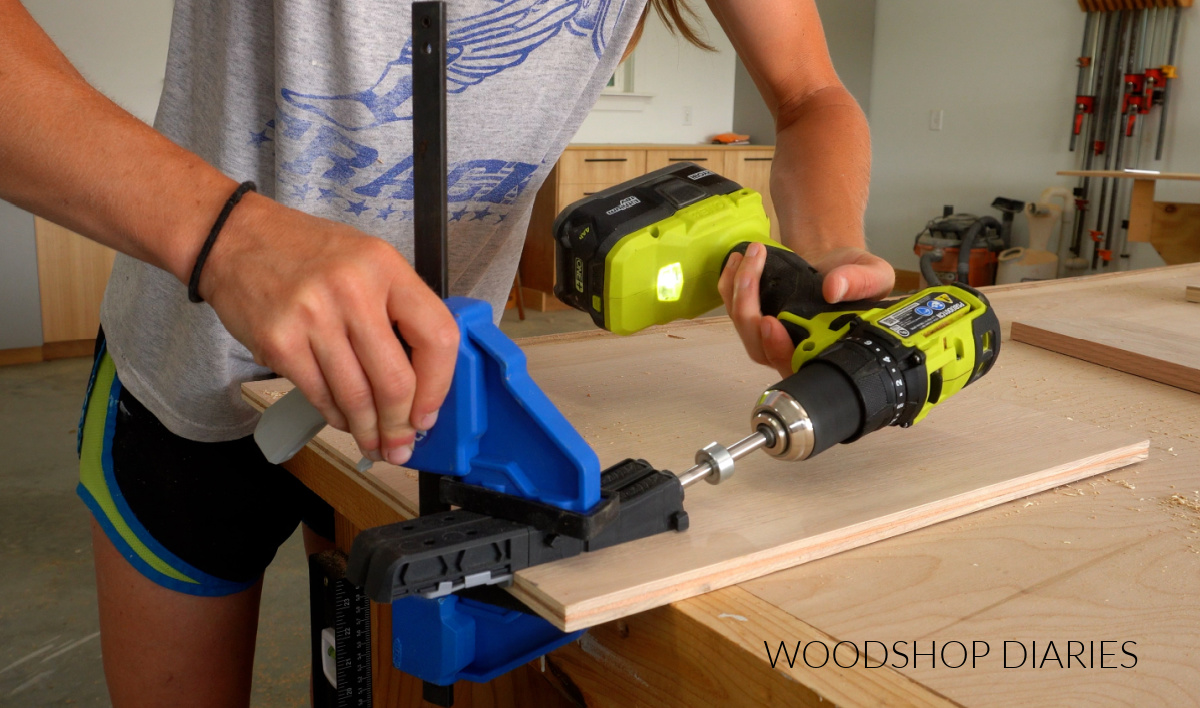Shara Woodshop Diaries drilling pocket holes in ½" plywood backer for mug shelf