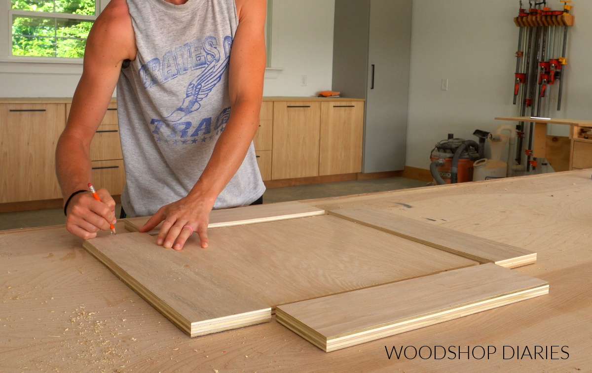 Shara Woodshop Diaries marking mug shelf sides to edge band on workbench