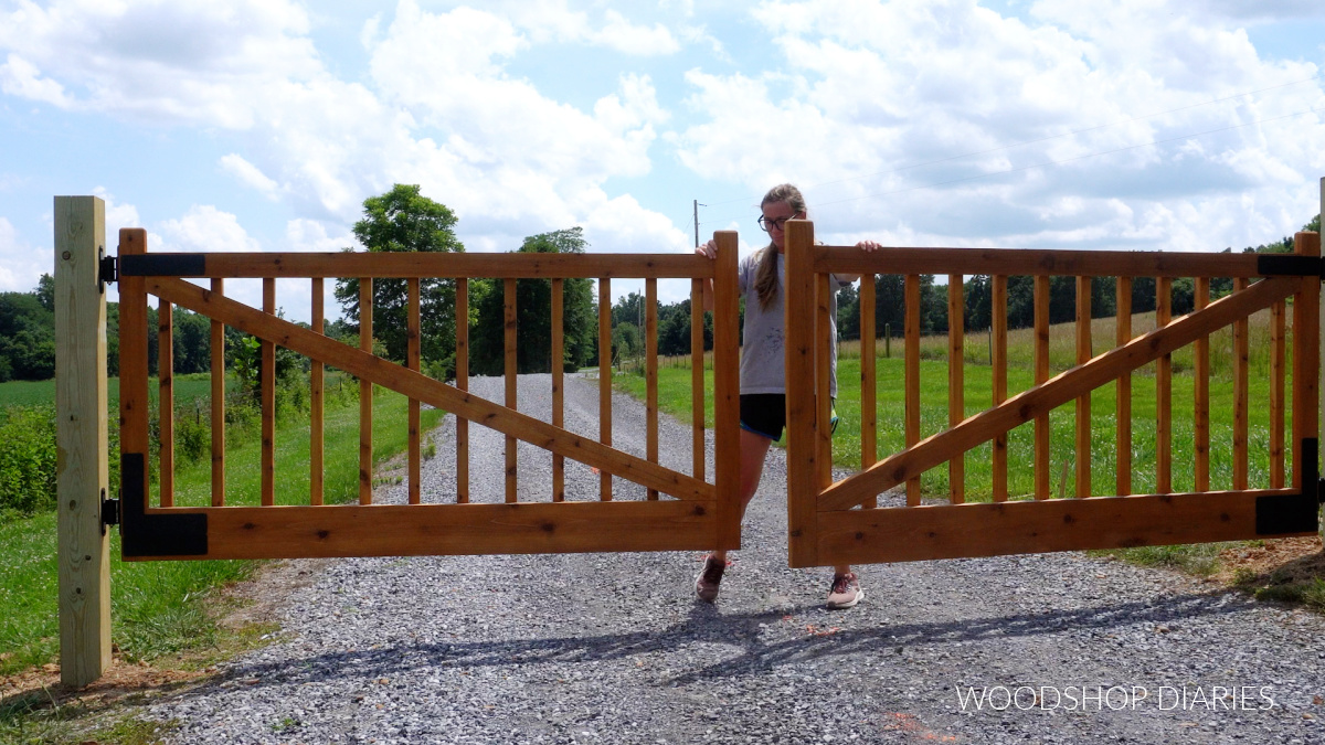 Shara Woodshop Diaries closing double wooden gates on driveway