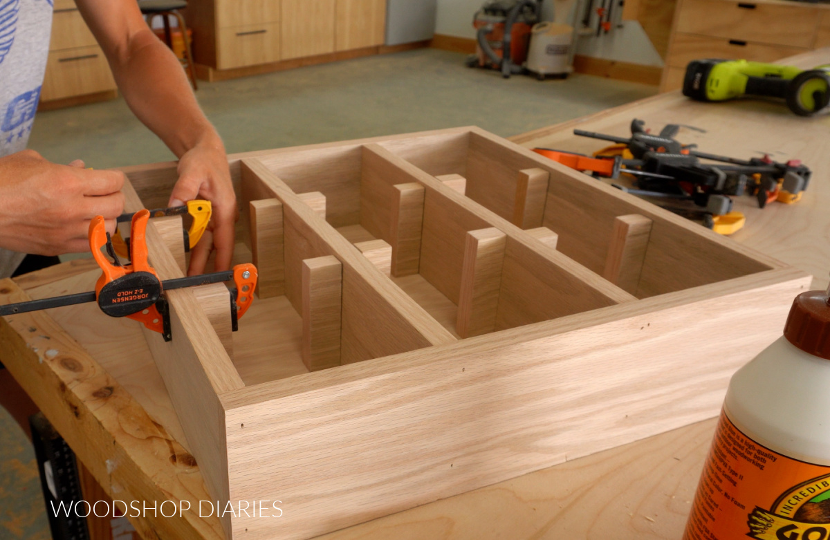 Shara Woodshop Diaries gluing dividers into shelf to separate cubbies for each mug