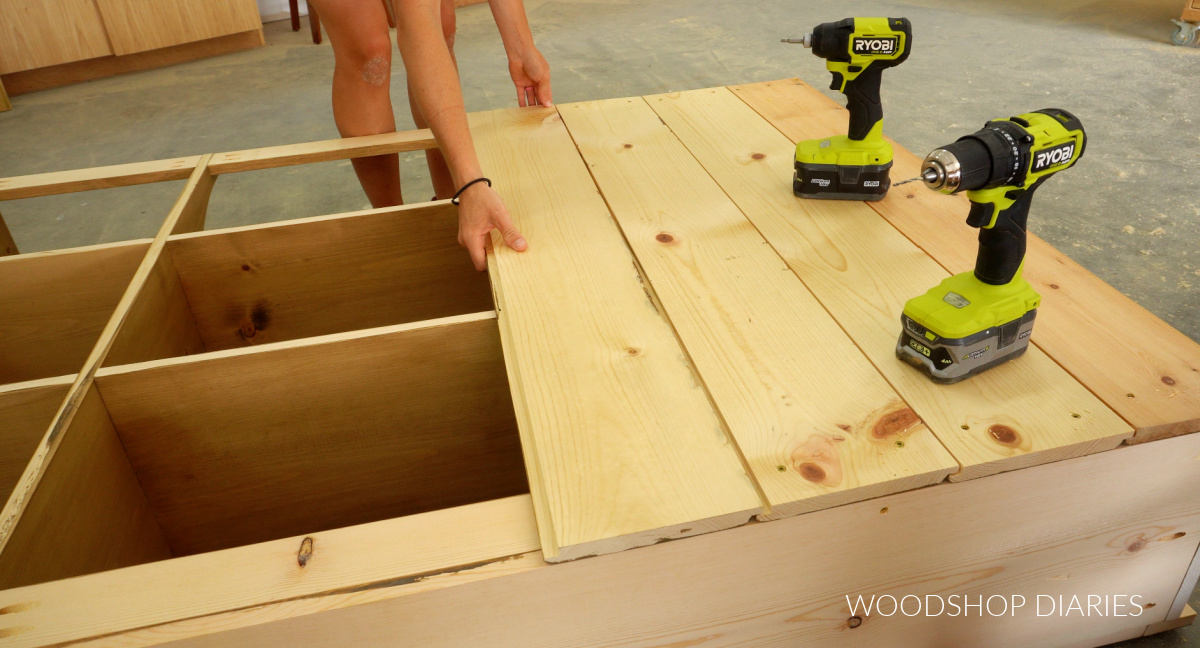 Shara Woodshop Diaries placing shiplap boards across back of hutch shelf