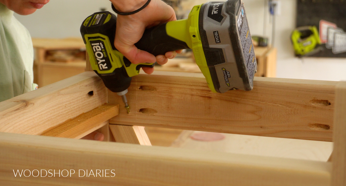 Close up of "toenailing" screw to secure side trim