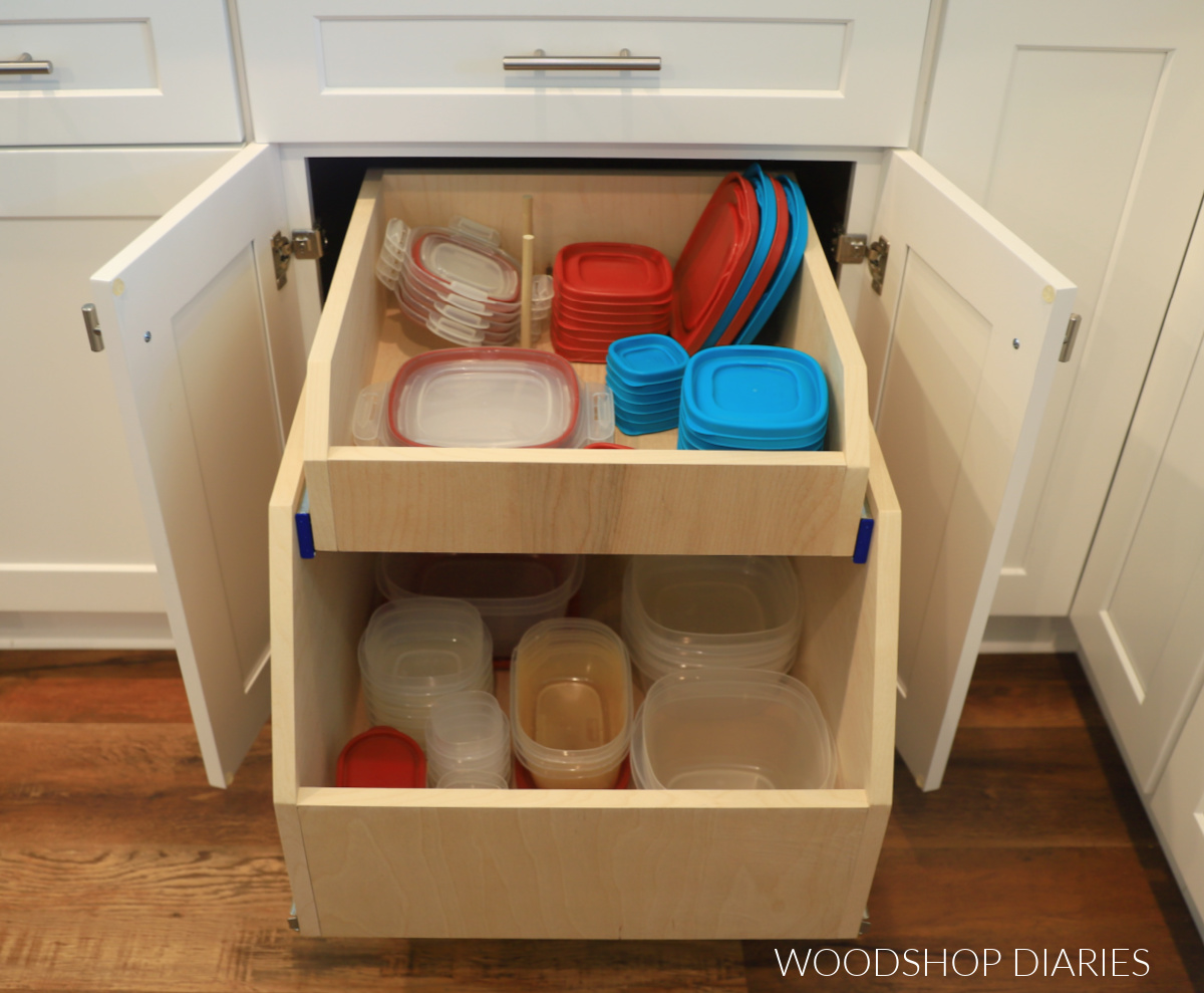 DIY cabinet organizer drawer in base cabinet fully extended with tupperware