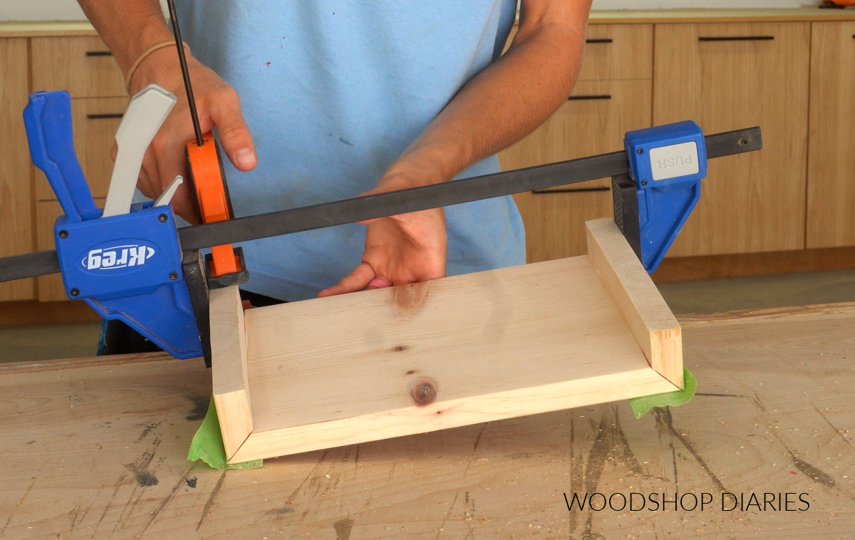 Shara Woodshop Diaries clamping waterfall edge riser board so glue can dry