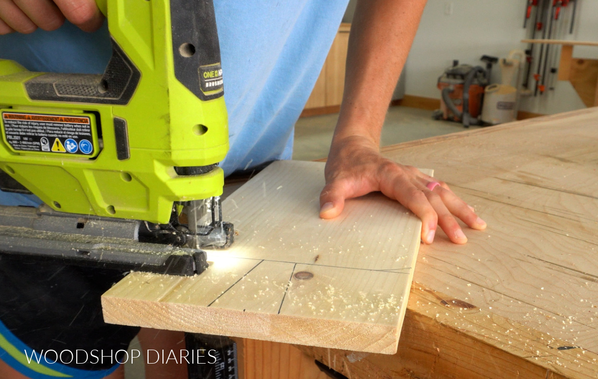 Shara Woodshop Diaries cutting handle shape out of pine board to make wooden riser