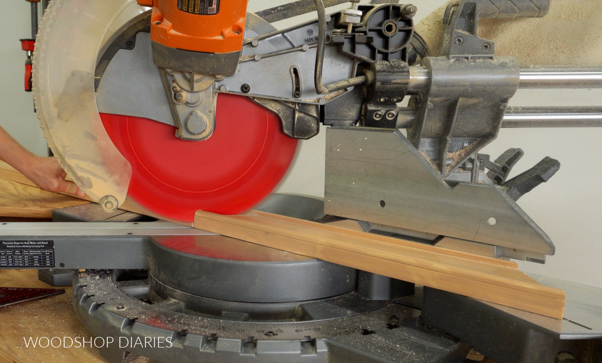 Miter saw set to 45 degrees opposite direction to cut other end of picture frame piece