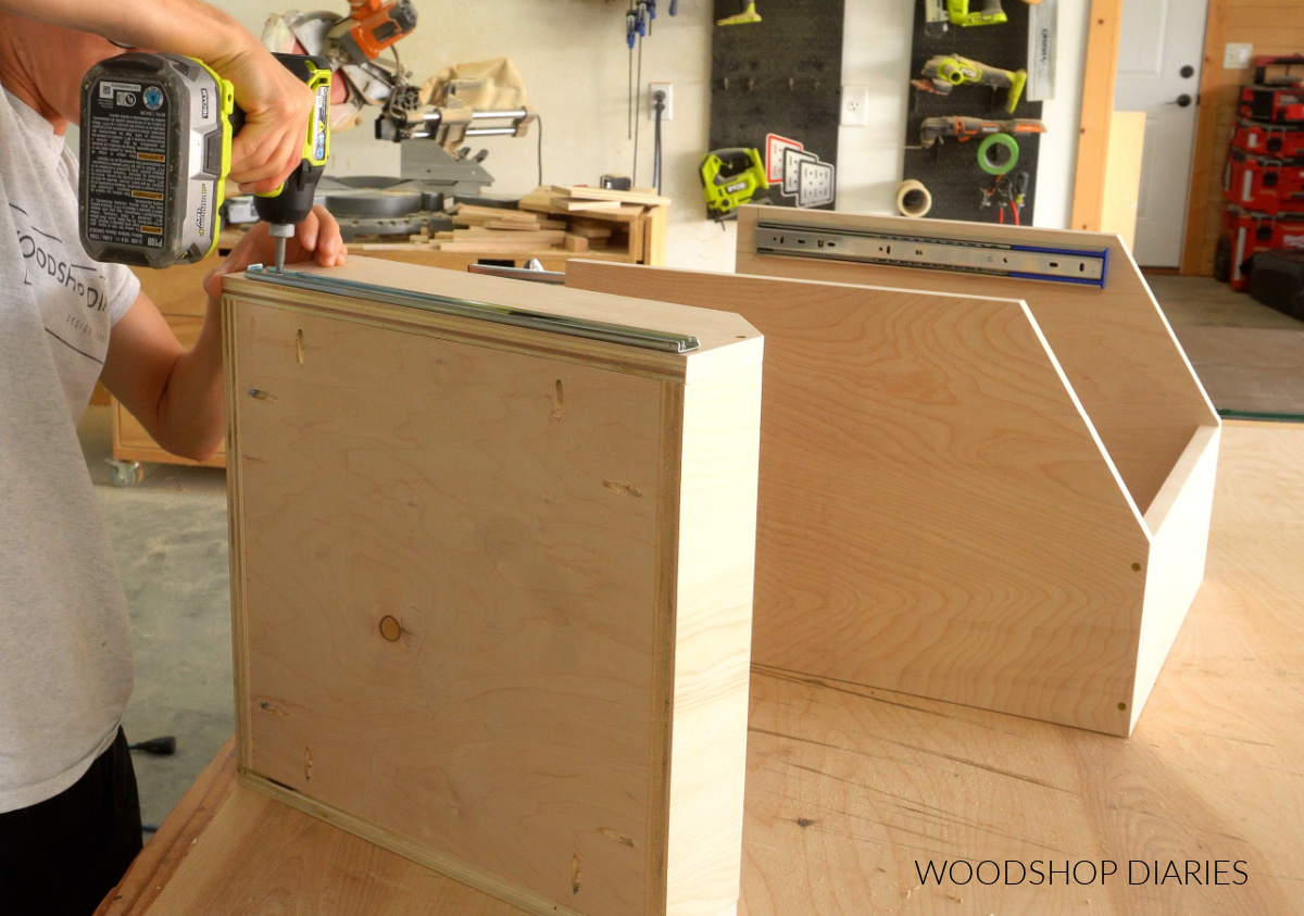 Shara Woodshop Diaries installing drawer slides onto upper drawer of cabinet organizer