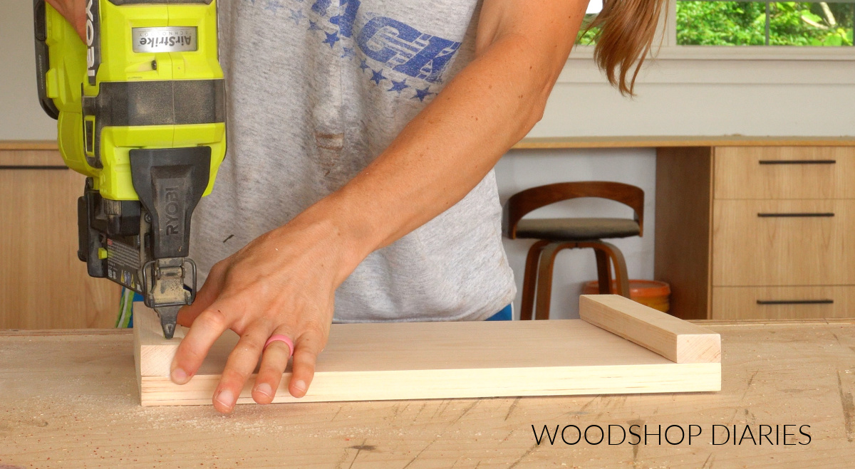Shara Woodshop Diaries gluing and nailing runners on bottom of riser board