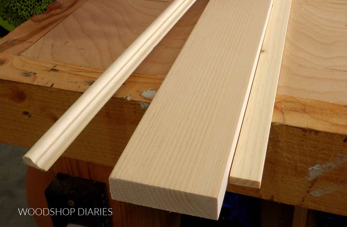 pine 1x3, chair rail molding and lattice trim laid on workbench