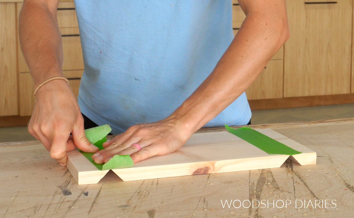 Shara Woodshop Diaries applying painters tape to board joints for glue up
