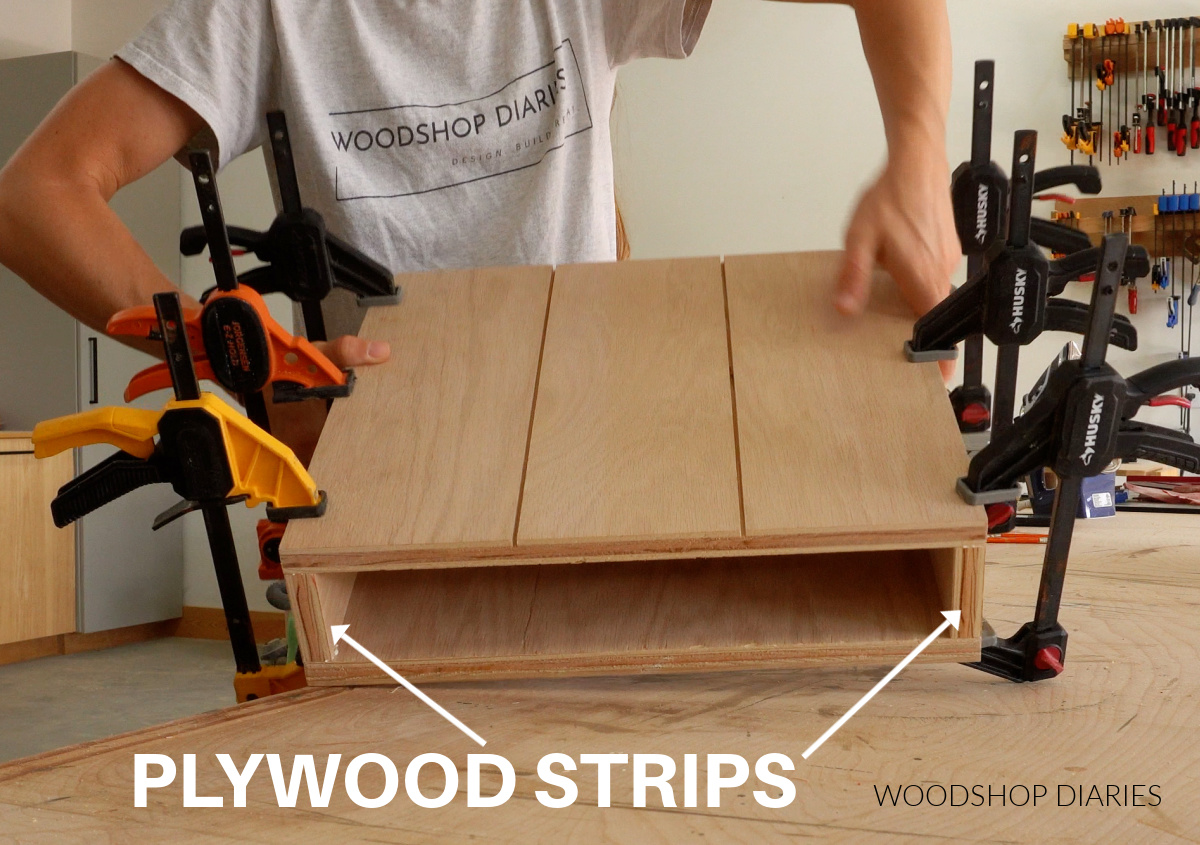 Shara Woodshop Diaries holding up hollow plywood box