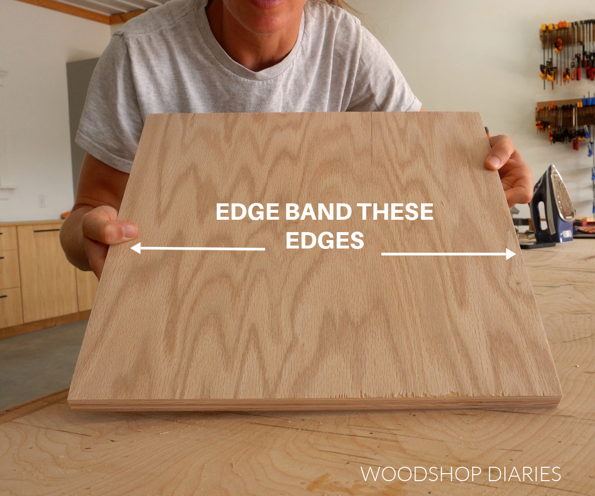 Shara Woodshop Diaries holding up plywood square with arrows showing which edges should be banded