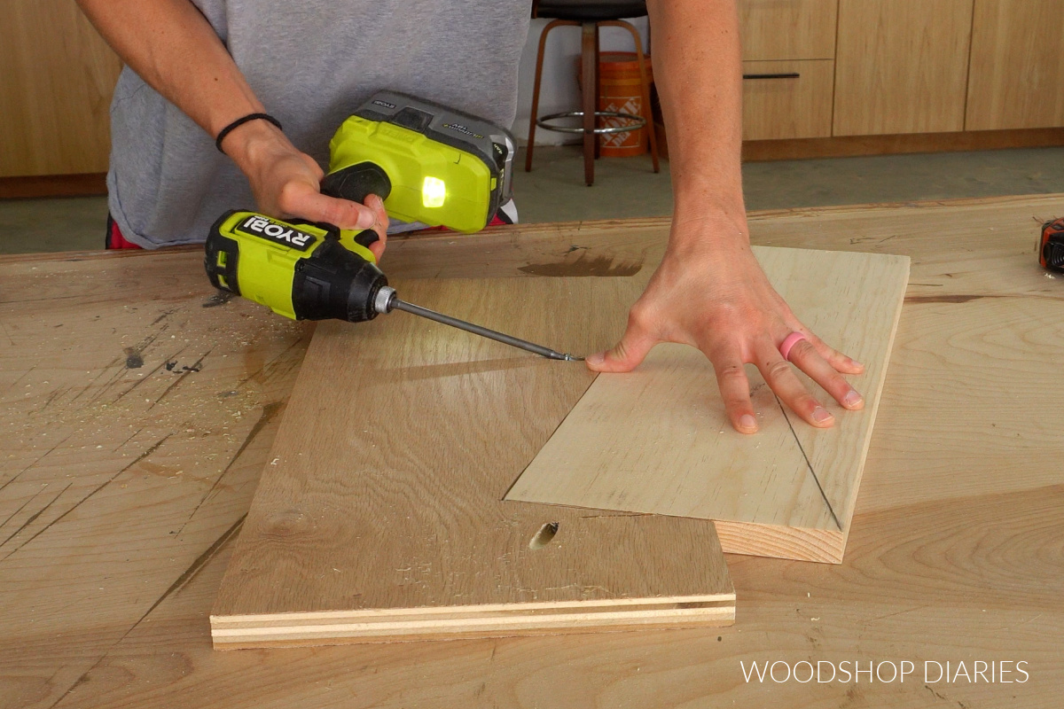 Shara Woodshop Diaries securing board into twisty table jig with pocket hole screws