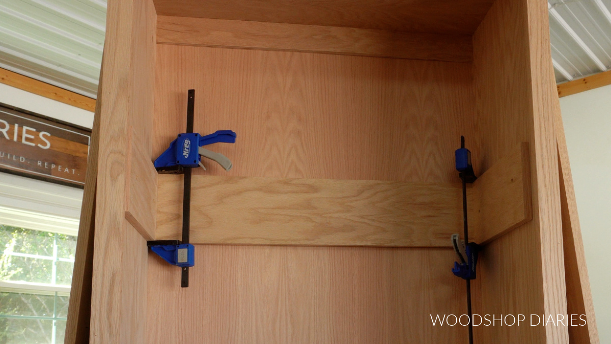 ¾" plywood strips clamped to inside of tall cabinet box for shelf supports